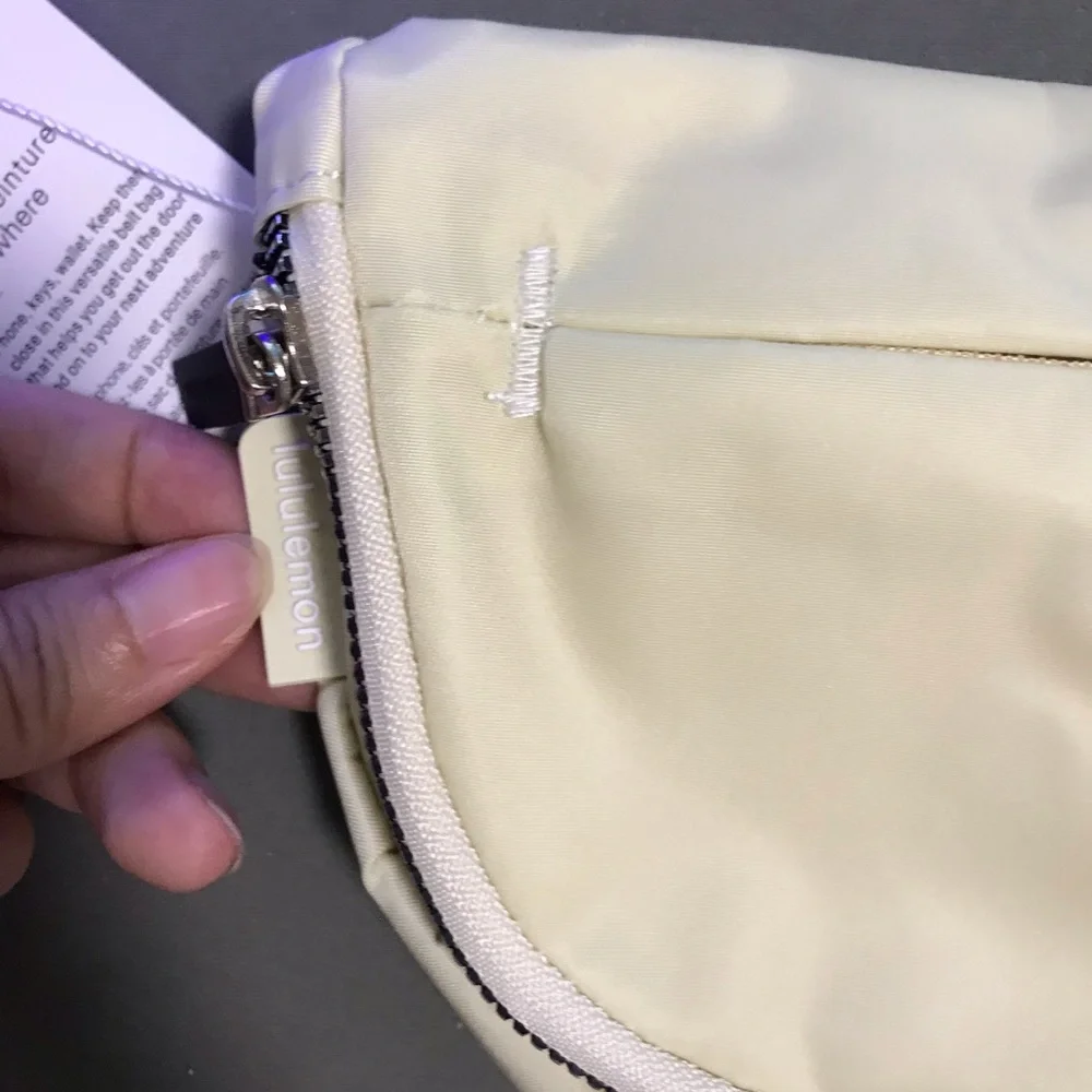 lululemon athletica cream fold-over wristlet with front zip 2L